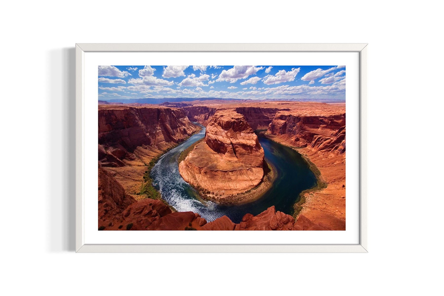 Framed aerial photograph of Horseshoe Bend in Page, AZ with a river cutting through red rock formations by Evan Reinheimer.
