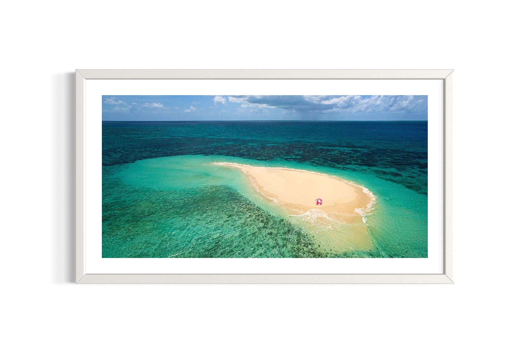 Framed aerial photograph of tropical island Vlasoff Cay, Australia with clear blue water and white sand by Evan Reinheimer.