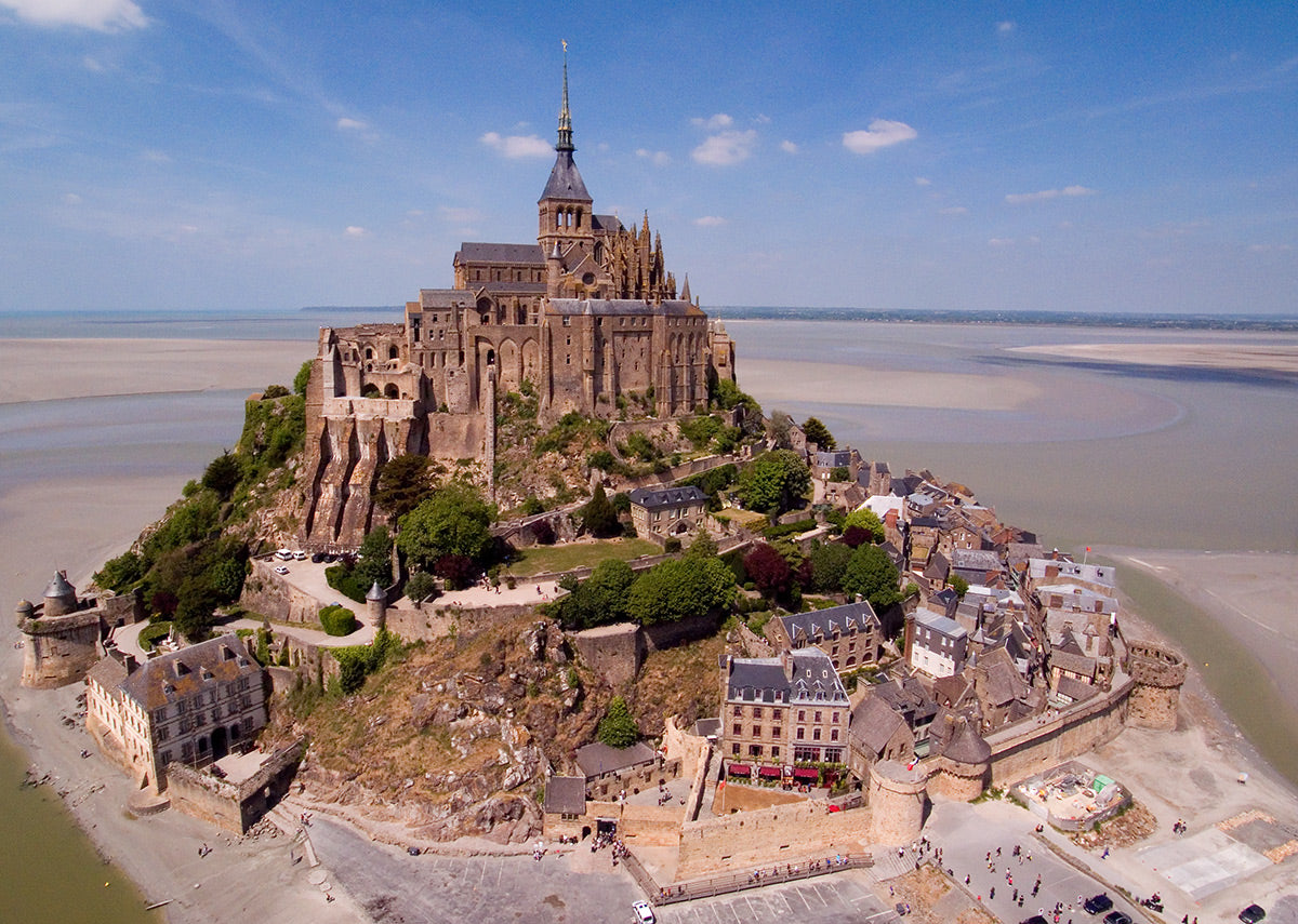 Aerial photograph of Mont Saint-Michel in Normandy, France by Evan Reinheimer.