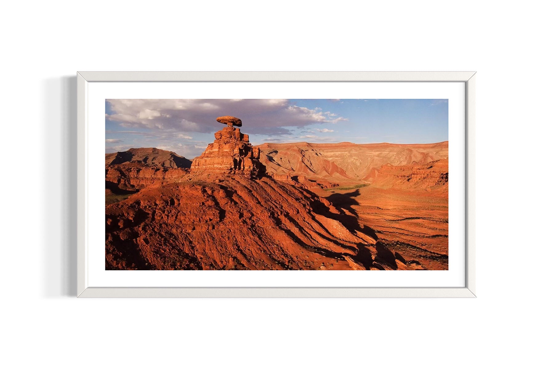Framed aerial photograph of the Mexican Hat Rock and desert landscape in Utah by Evan Reinheimer.